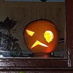 Cambridge Ghost Walks: Halloween pumpkin in a window